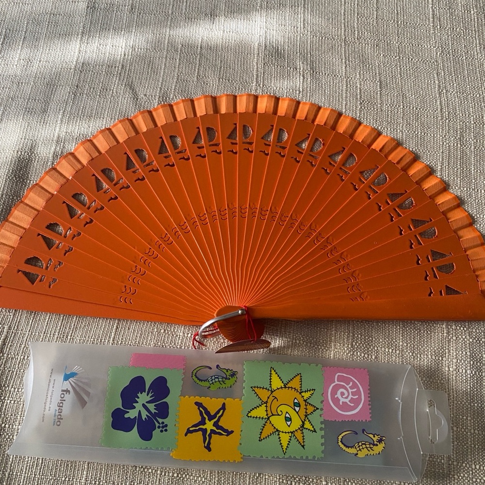 Orange Hand Fan brand new